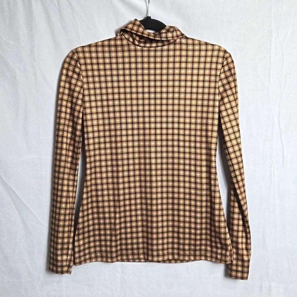 ROKH.. mask, houndstooth, turtleneck top..
